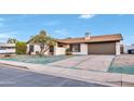 Exterior view of a well-kept home with a 2-car garage and front yard at 753 W Pampa Ave, Mesa, AZ 85210