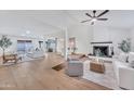 Bright and airy living room with hardwood floors, fireplace, and recessed lighting at 753 W Pampa Ave, Mesa, AZ 85210