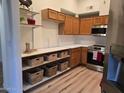 Efficient kitchen featuring stainless steel appliances, wooden cabinetry, and ample counter space at 7565 N Vía De La Siesta --, Scottsdale, AZ 85258