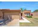 Charming home featuring a tile roof, well-maintained lawn, and inviting curb appeal on a sunny day at 9512 W Mcrae Way, Peoria, AZ 85382