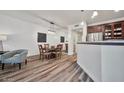 Inviting living room and dining area with hardwood floors, lots of natural light, and modern decor at 15221 N Clubgate Dr # 2065, Scottsdale, AZ 85254