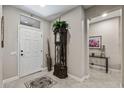 Elegant entryway with tile flooring, decorative accents, and natural light at 15797 W Cinnabar Dr, Surprise, AZ 85374