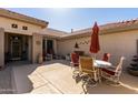 Private courtyard with patio furniture, ideal for dining or relaxation at 15797 W Cinnabar Dr, Surprise, AZ 85374