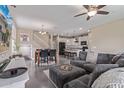 Spacious living room area that flows into dining area and modern kitchen at 15812 W Lisbon Ln, Surprise, AZ 85379