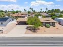 Aerial view of a home with desert landscaping, covered carport, and arched window accents at 1902 E 8Th St, Mesa, AZ 85203