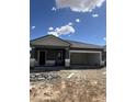 New home construction featuring a neutral color palette and open garage at 2011 E Bucking Bronco Dr, San Tan Valley, AZ 85140