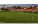Picturesque view of the golf course with green fairway and the beautiful homes in the background at 22208 N San Ramon Dr, Sun City West, AZ 85375