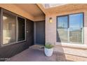 Inviting entryway with a stylish front door, large windows, and a potted plant at 2320 S Forest Ave, Tempe, AZ 85282