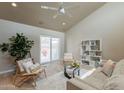 Cozy living room with a ceiling fan, comfortable seating, and sliding glass doors at 2320 S Forest Ave, Tempe, AZ 85282