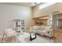 Bright living room featuring high ceilings, modern furnishings, and a comfortable sofa at 2320 S Forest Ave, Tempe, AZ 85282