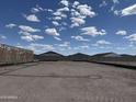 Picture of a new construction backyard with block fencing under a beautiful sky at 24113 W Bowker St, Buckeye, AZ 85326
