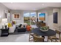 Bright living area featuring contemporary decor and an outdoor view at 2463 W Rowel Rd, Phoenix, AZ 85085