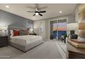 Relaxing main bedroom with natural light and access to a private balcony at 2463 W Rowel Rd, Phoenix, AZ 85085