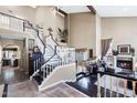 Grand foyer featuring a dramatic staircase, soaring ceilings, and views into the elegant living spaces at 3209 E Fox St, Mesa, AZ 85213