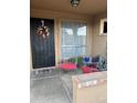 Cozy covered porch with seating area, decorative wreath, and a welcoming atmosphere at 426 W Pontiac W Dr # 4, Phoenix, AZ 85027