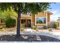 Inviting home featuring a well-manicured front yard with mature trees and desert landscaping at 4349 E Selena Dr, Phoenix, AZ 85050