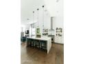 Bright, spacious kitchen with white cabinets, marble countertops, and a center island at 4817 N 35Th St, Phoenix, AZ 85018