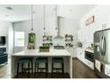 Bright, spacious kitchen with white cabinets, marble countertops, and a center island at 4817 N 35Th St, Phoenix, AZ 85018