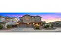 Charming two-story home boasts a three-car garage, stone accents, and manicured front yard at 5231 W Desperado Way, Phoenix, AZ 85083