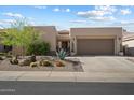 Charming single-story home featuring a low-maintenance desert landscape and a two-car garage at 6579 E Shooting Star Way, Scottsdale, AZ 85266