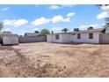 Expansive backyard features a storage shed, surrounded by a tall block fence at 7614 W Cheery Lynn Rd, Phoenix, AZ 85033