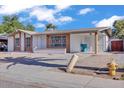 Quaint single-story home with a covered parking area, complemented by a neat front yard at 7614 W Cheery Lynn Rd, Phoenix, AZ 85033