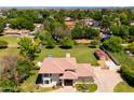 An aerial view of a residence showcasing its sizable lot, mature trees, and serene surroundings at 10532 W Catalina Dr, Avondale, AZ 85392