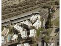 Aerial view of the complex with a pool and convenient parking, surrounded by desert landscape at 12123 W Bell Rd # 337, Surprise, AZ 85378