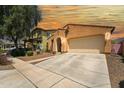 Inviting single-Gathering home with a two-car garage and a well-manicured front yard at 14916 W Georgia Dr, Surprise, AZ 85379