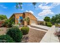 Charming single-story home with a well-maintained front yard and inviting curb appeal at 14916 W Georgia Dr, Surprise, AZ 85379