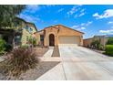 Lovely single-Gathering home with a two-car garage and lush landscaping at 14916 W Georgia Dr, Surprise, AZ 85379