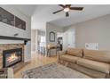 Inviting living room with a stone fireplace, wood floors, and open layout at 1601 N Saba St # 308, Chandler, AZ 85225