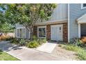 Inviting townhouse featuring well-manicured landscaping and a cozy, brick-accented front entrance at 1601 N Saba St # 308, Chandler, AZ 85225