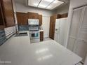 Well-equipped kitchen with quartz countertops, modern appliances and ample storage at 1633 E Lakeside Dr # 39, Gilbert, AZ 85234