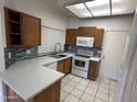 Bright kitchen featuring quartz countertops, modern backsplash, and stainless steel appliances at 1633 E Lakeside Dr # 39, Gilbert, AZ 85234