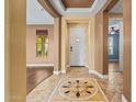 Elegant home foyer with decorative tiled flooring and neutral walls, creating a welcoming entrance at 21104 W Sage Hill Rd, Buckeye, AZ 85396