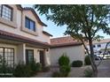 This townhome boasts a well-maintained exterior and a red tile roof at 2941 N Oregon St # 12, Chandler, AZ 85225