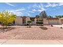 Charming single-story home showcasing desert landscaping and a well-maintained front yard at 4803 W Harmont Dr, Glendale, AZ 85302
