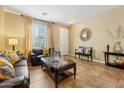 Inviting living room with tile floors, comfortable seating, and tasteful decor at 5136 W Trotter Trl, Phoenix, AZ 85083