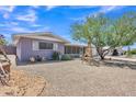 Charming single-story house, complemented by a mature tree and desert landscaping at 6749 E Ellis St, Mesa, AZ 85205