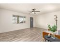 Bright living room with stylish wood flooring, a ceiling fan, and a serene atmosphere at 6907 E Portland St, Scottsdale, AZ 85257