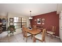 Bright dining room features a large window, tile flooring, and traditional furnishings at 6945 E Cochise E Rd # 117, Paradise Valley, AZ 85253