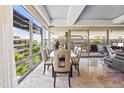 Bright dining area with floor-to-ceiling windows, a glass table, and modern chairs at 7131 E Rancho Vista Dr # 7011, Scottsdale, AZ 85251