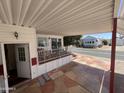 Charming exterior view of the home with covered patio and well-maintained landscaping at 7750 E Broadway Rd # 604, Mesa, AZ 85208
