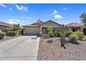 Charming single-story home featuring a two-car garage and desert landscaping at 1081 W Stephanie Ln, San Tan Valley, AZ 85143