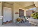 Inviting front porch with seating area, rug, and decorative accents at 1081 W Stephanie Ln, San Tan Valley, AZ 85143