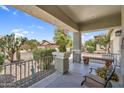 Inviting front porch with decorative statue, seating, and an American flag at 1081 W Stephanie Ln, San Tan Valley, AZ 85143