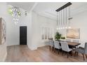 Dining room showcases modern lighting, hardwood floors and easy access to living areas at 11143 E Onyx Ct, Scottsdale, AZ 85259