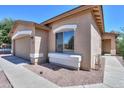 Exterior view of a single Gathering home showing a window and garage with a well kept yard at 1983 W Allens Peak Rd, Queen Creek, AZ 85144