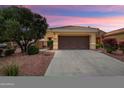 Charming home featuring a tile roof, desert landscaping, and a spacious two-car garage at 22504 N San Ramon Dr, Sun City West, AZ 85375